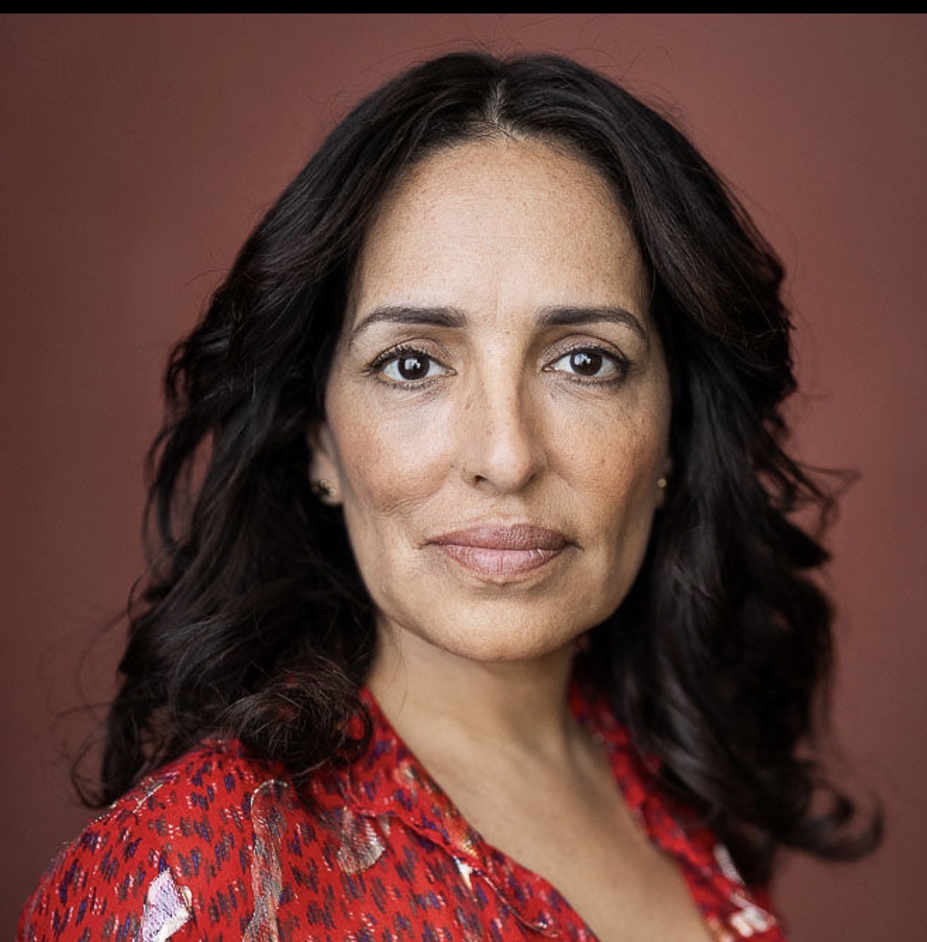 Alma Blue — headshot in red